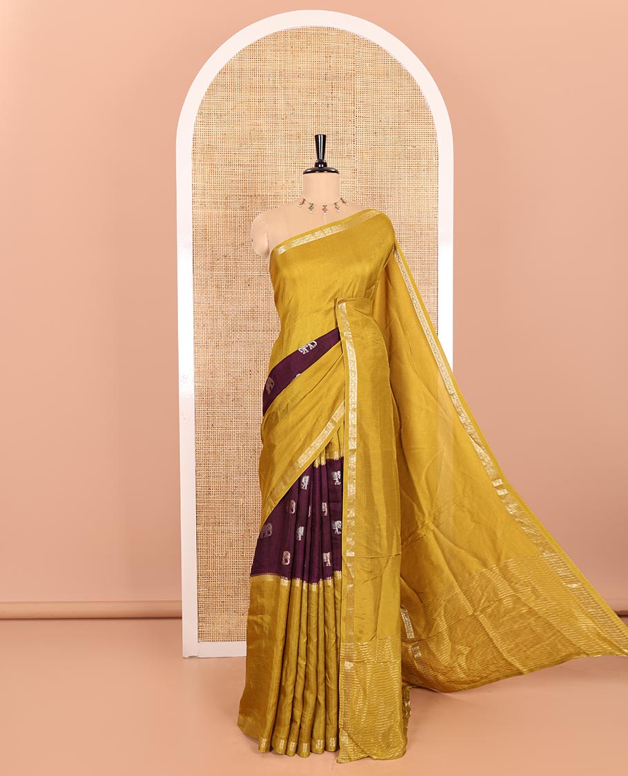 Mustard Russian Silk Saree Featuring Double-Sided Plain and Central Zari Elephant Motifs Weave, Accentuated by a Subtle Traditional Zari Border, Enhanced with a Zari-Designed Pallu, and Paired with a Blouse Depicting Meenakari Peacocks
