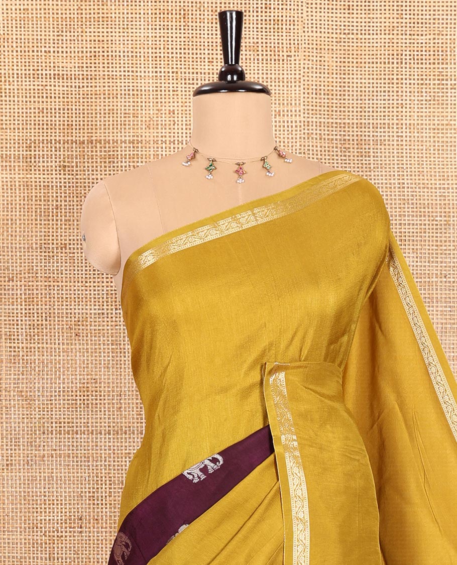 Mustard Russian Silk Saree Featuring Double-Sided Plain and Central Zari Elephant Motifs Weave, Accentuated by a Subtle Traditional Zari Border, Enhanced with a Zari-Designed Pallu, and Paired with a Blouse Depicting Meenakari Peacocks
