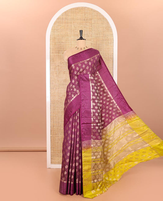 Purple Semi-Tussar Saree Adorned with Copper Zari Floral Bud Motifs, Featuring a Floral Creeper Embossed Border, Complemented by a Contrast Pallu Adorned with Floral Bud Motifs, and Paired with a Contrast Blouse