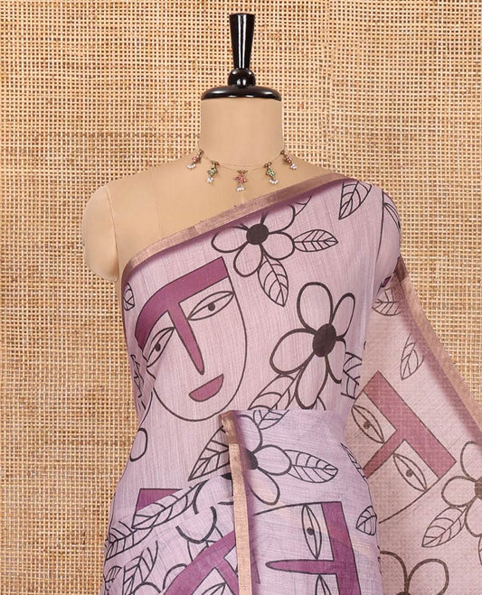 Light Purple Linen Cotton Saree, Featuring Flowers and Faces Printed on Its Body, Subtle Zari Piping Border, Pallu Mirrors the Self-Print, and Comes with a Contrast Blouse