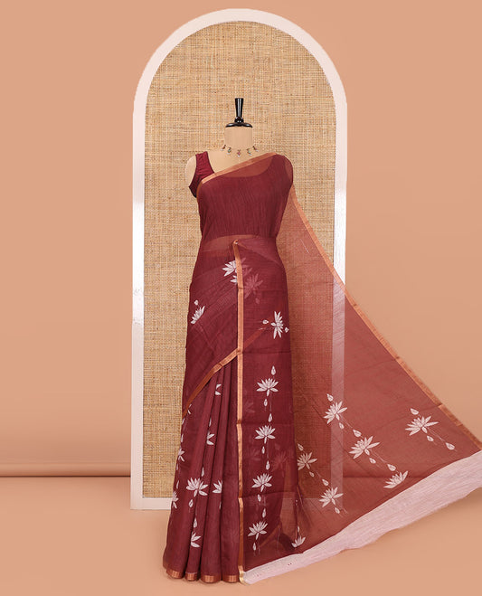 Maroon Linen Cotton Saree, Elevated with Pichwai Lotus Motifs Print, Subtle Piping Border, Pallu Mirrors the Same Pichwai Lotus Print, and Paired with a Contrast Pichwai Lotus Printed Blouse