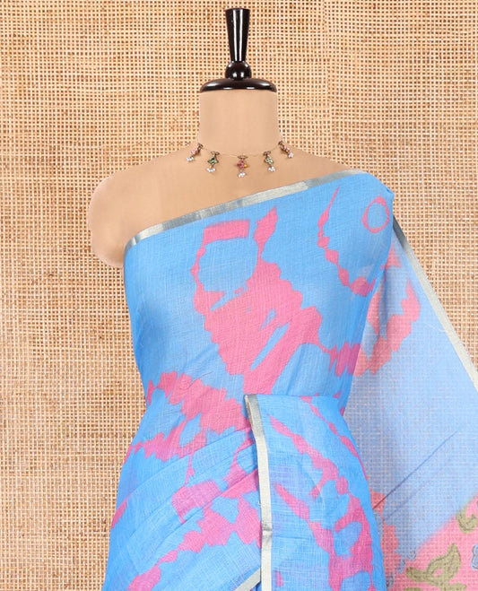 Light Blue Linen Cotton Saree, Graced with Shibori Printed on Its Body, Subtle Piping Border, Pallu Features Floral Print, and Paired with a Contrast Floral Printed Blouse