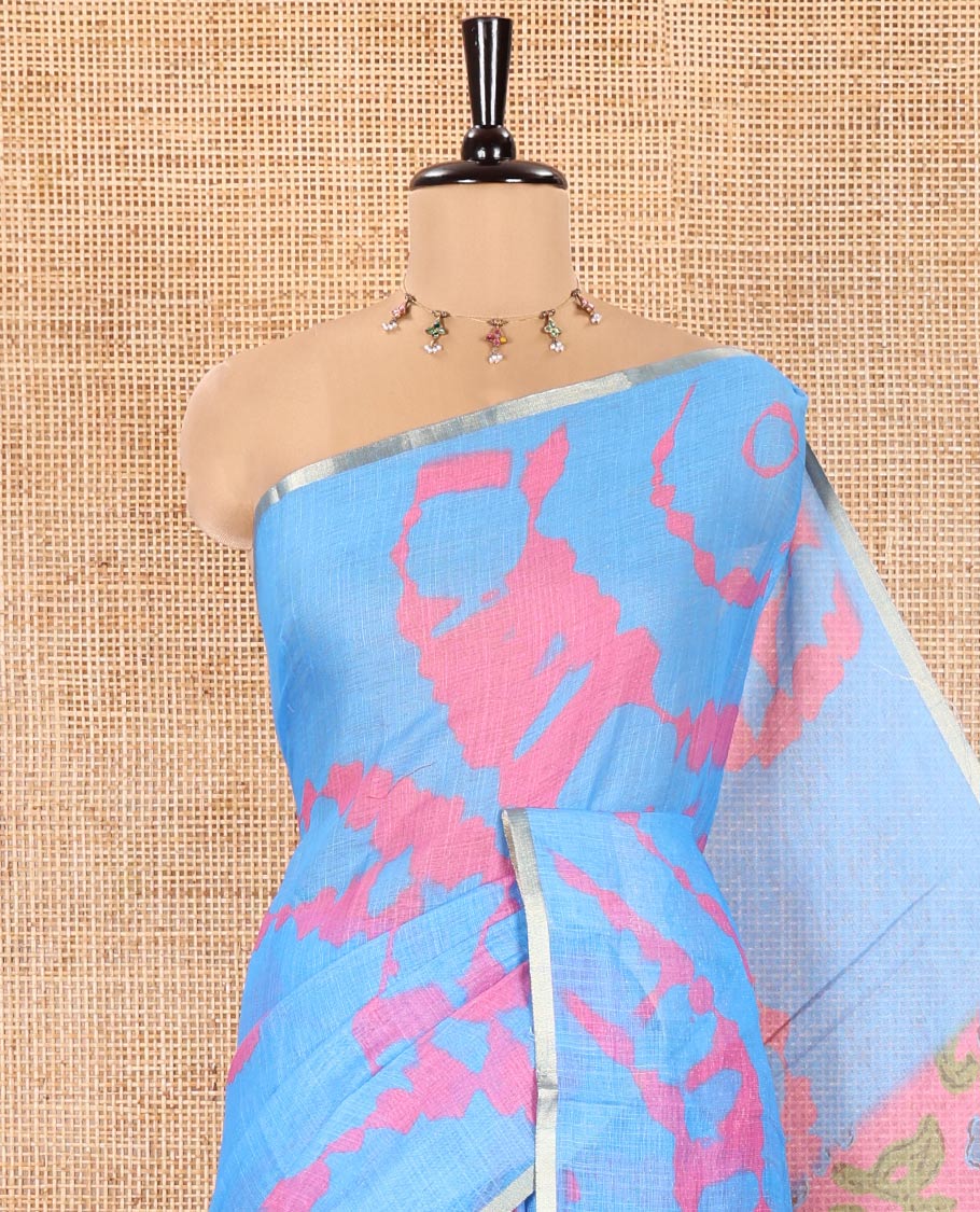 Light Blue Linen Cotton Saree, Graced with Shibori Printed on Its Body, Subtle Piping Border, Pallu Features Floral Print, and Paired with a Contrast Floral Printed Blouse