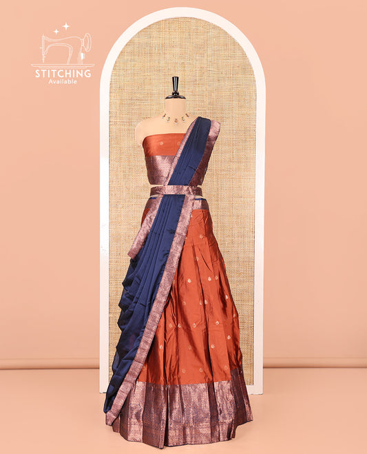 Rust-Blue Semi-Banarasi Half-Saree Features Zari Buttas Skirt, a Contrast Traditional Zari Border, a Matching Blouse, and a Contrast Satin Georgette Dhavani