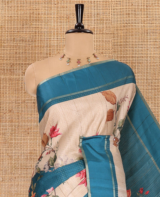 Peacock blue floral printed fancy tussar saree, contrast small zari border, and zari design pallu, and a contrast floral printed blouse