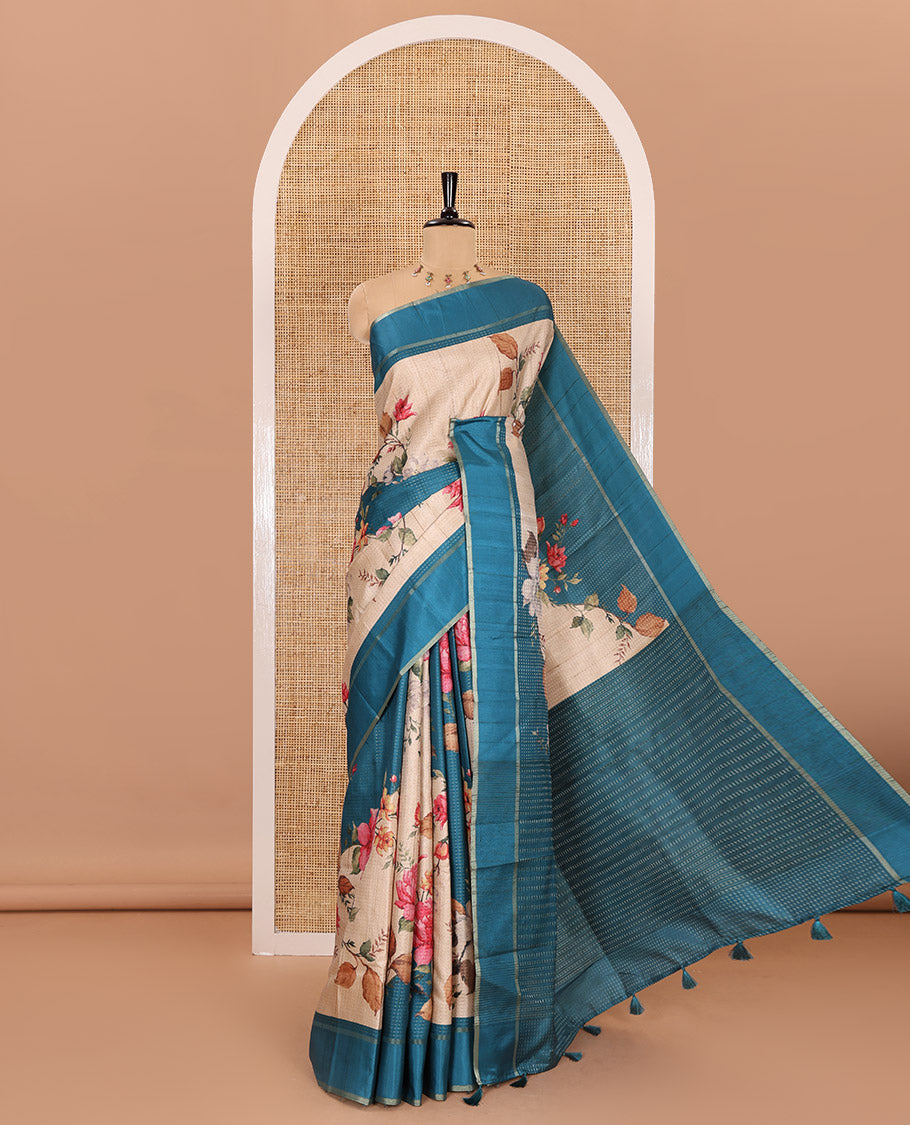 Peacock blue floral printed fancy tussar saree, contrast small zari border, and zari design pallu, and a contrast floral printed blouse