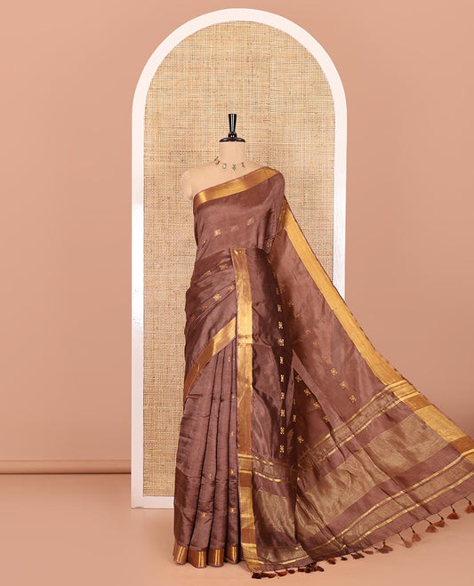 Coffee brown zari buttas banana pith silk saree, zari bavanji border, zari striped pallu, and a matching zari design blouse