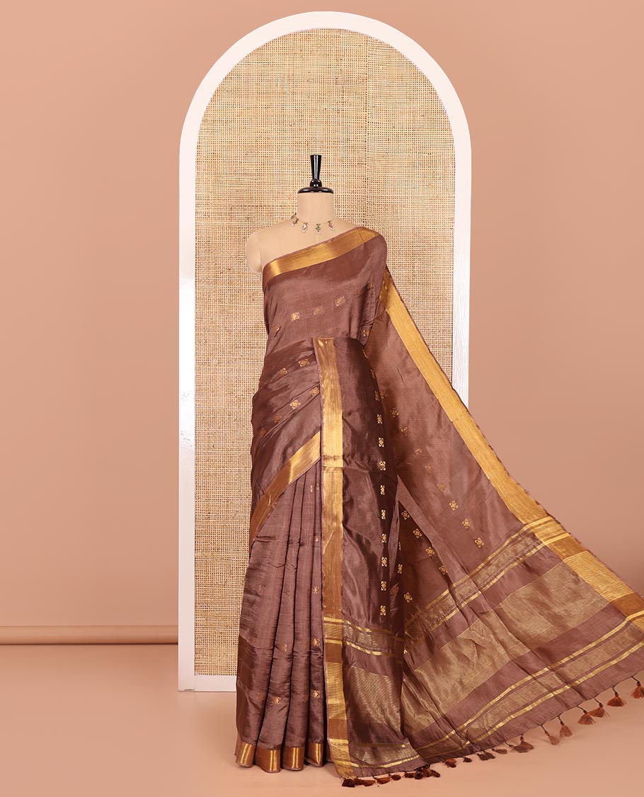 Coffee brown zari buttas banana pith silk saree, zari bavanji border, zari striped pallu, and a matching zari design blouse