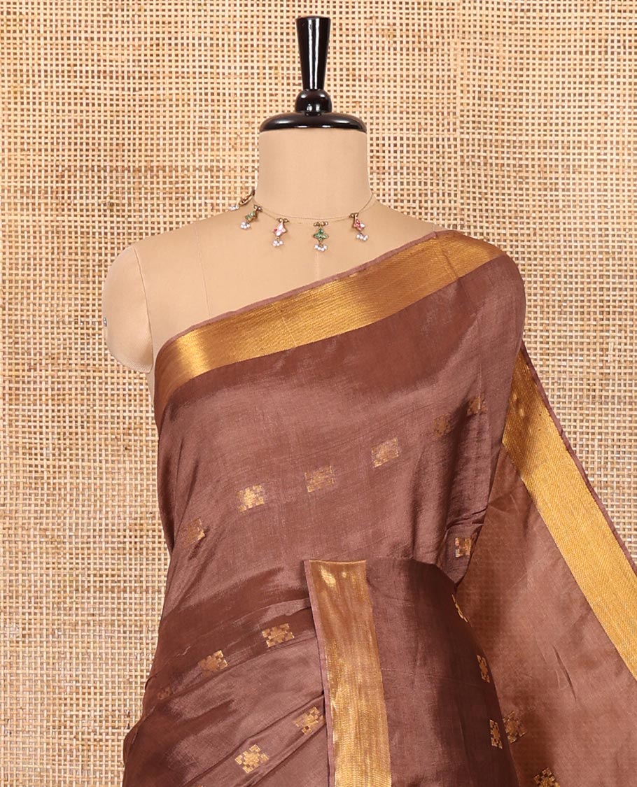 Coffee brown zari buttas banana pith silk saree, zari bavanji border, zari striped pallu, and a matching zari design blouse