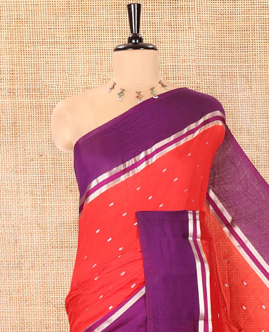Red Assam Silk Saree, Elevated with Zari Buttas on Its Body, Complemented by Contrast Zari Striped Border, Pallu Steeped with Gleaming Zari Stripes and Buttas, and Paired with a Contrast Blouse