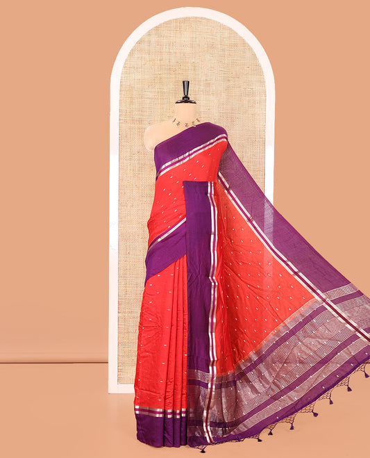 Red Assam Silk Saree, Elevated with Zari Buttas on Its Body, Complemented by Contrast Zari Striped Border, Pallu Steeped with Gleaming Zari Stripes and Buttas, and Paired with a Contrast Blouse