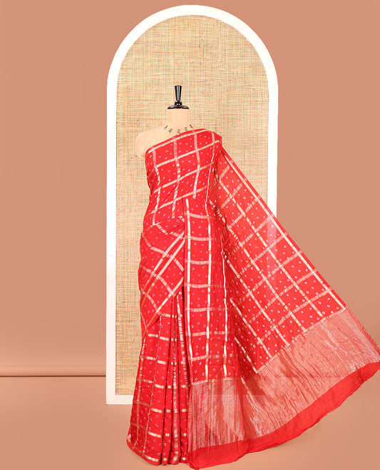 Borderless Red Assam Silk Saree, Richly Detailed with Bandhani-Dotted Ghar Chola Design on Its Body, Gleaming Zari Pallu, and Paired with a Matching Blouse