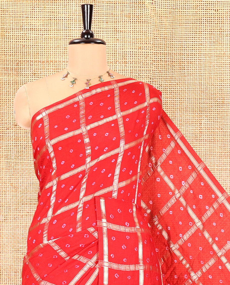 Borderless Red Assam Silk Saree, Richly Detailed with Bandhani-Dotted Ghar Chola Design on Its Body, Gleaming Zari Pallu, and Paired with a Matching Blouse