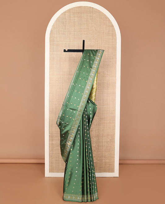 Green paisely motifs soft silk saree with self zari design border & floral design pallu