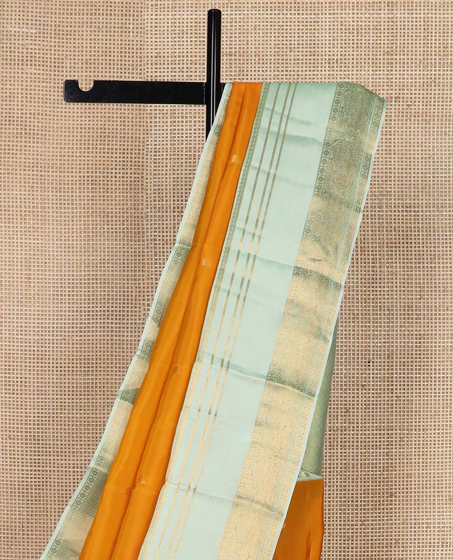 Orange zari buttas Vasundhara silk mix saree, contrast rettai pettu border of muthu, kamalam and annam designs, and intricate pallu