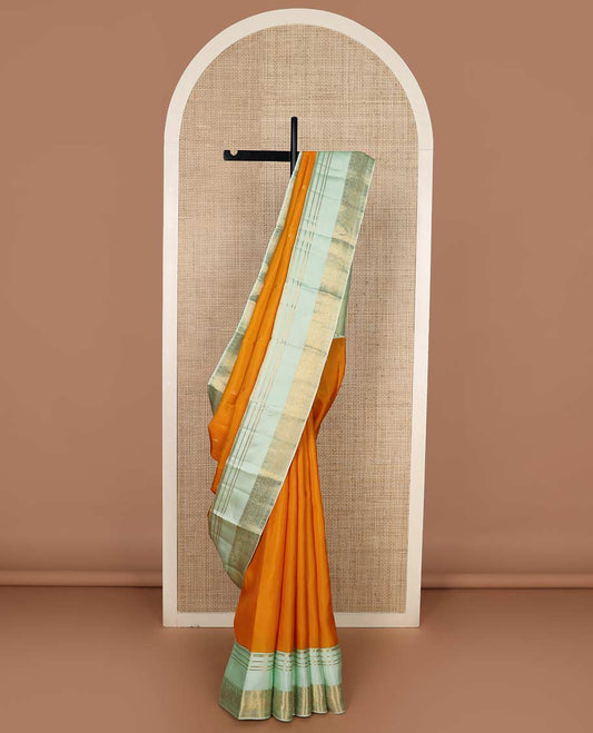 Orange zari buttas Vasundhara silk mix saree, contrast rettai pettu border of muthu, kamalam and annam designs, and intricate pallu
