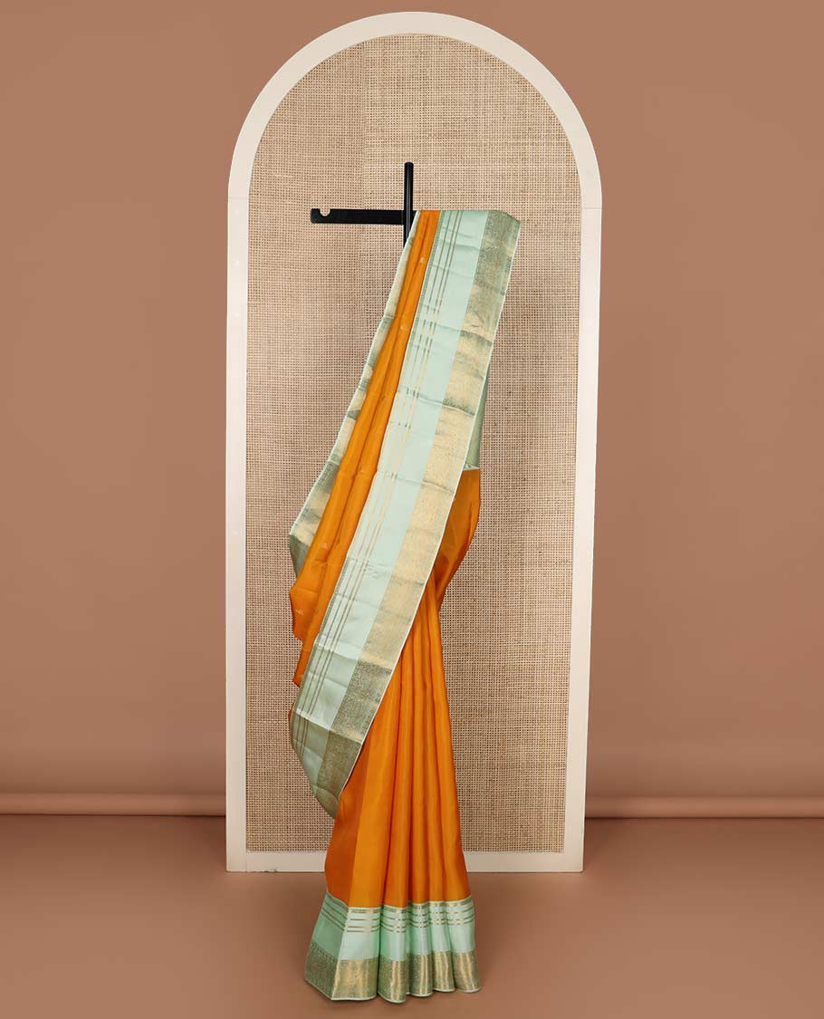 Orange zari buttas Vasundhara silk mix saree, contrast rettai pettu border of muthu, kamalam and annam designs, and intricate pallu