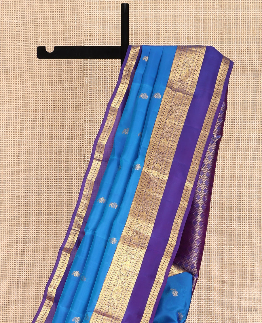 Blue Vasundhara Lite Silk Mix Saree, Detailed with Zari Buttas on Its Body, Complemented by a Contrast Border of Thilakam, Rudraksham, Manga, and Mayil Designs, Grand Pallu, and Paired with a Contrast Blouse