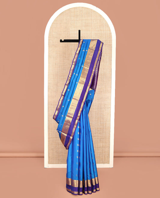 Blue Vasundhara Lite Silk Mix Saree, Detailed with Zari Buttas on Its Body, Complemented by a Contrast Border of Thilakam, Rudraksham, Manga, and Mayil Designs, Grand Pallu, and Paired with a Contrast Blouse