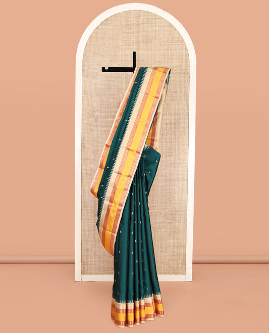 Teal Vasundhara Lite-Silk Mix Saree, Decked Up with Zari Buttas, Contrast Temple Border of Mayil Design, Paiyadi Kattam Pallu, and a Contrast Blouse
