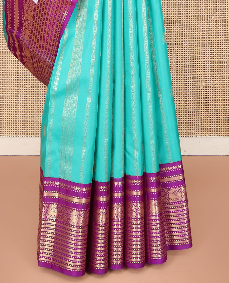 Blue Vasundhara Silk Saree, Embellished with Zari Designs All Over Its Body, Complemented by a Contrast Korvai Border of Thilakam Mokku, Muthu, and Yaali Designs, Grand Jaal Pallu, and Paired with a Contrast Blouse