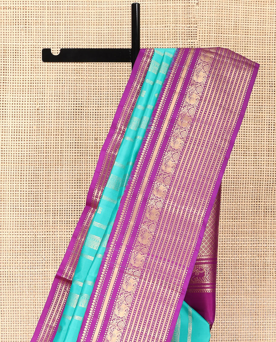 Blue Vasundhara Silk Saree, Embellished with Zari Designs All Over Its Body, Complemented by a Contrast Korvai Border of Thilakam Mokku, Muthu, and Yaali Designs, Grand Jaal Pallu, and Paired with a Contrast Blouse