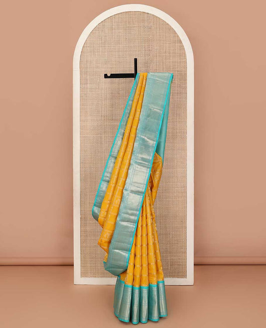 Yellow zari design silk saree, contrast border of arumbu manga, kamalam, Muthu, and mayil kann, and geometric patterns zari woven pallu