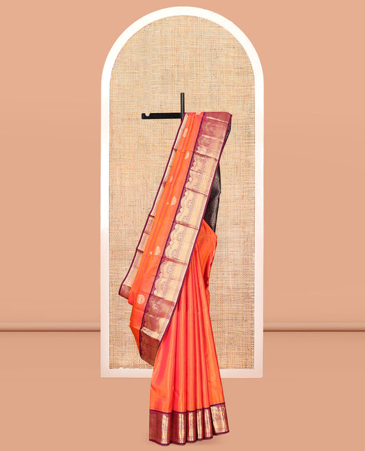 Orange Vasundhara Silk Saree Featuring Zari Buttas, Contrast Traditional Zari Border, Pallu Steeped with Paisleys, and Contrast Blouse