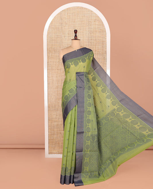 Green Semi-Silk Cotton Saree, Finely Crafted with Buttas and Checks All Over Its Body, Complemented by a Contrast Border, Pallu of Jaal Designs, and Paired with a Matching Blouse