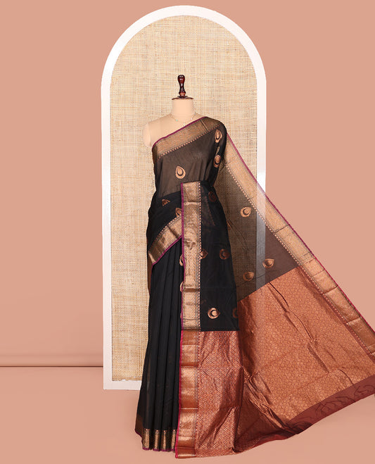 Black Semi-Silk Cotton Saree, Beautifully Bedecked with Zari Buttas on Its Body, Complemented by Contrast Traditional Zari Border, Zari-Rich Pallu of Jaal Designs, and Paired with a Contrast Blouse