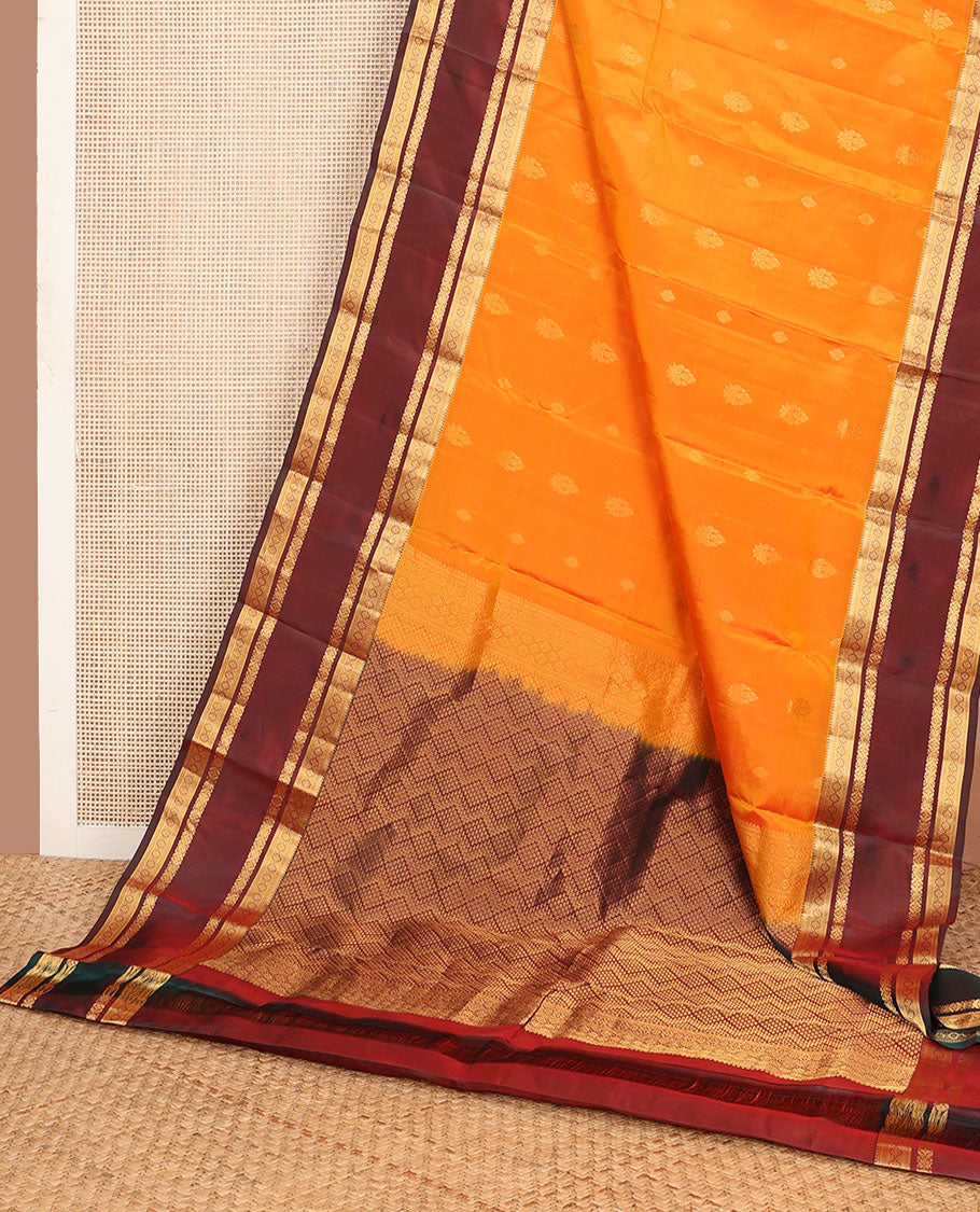 Mango yellow zari design vasundhara silk mix saree, contrast border of thilakam,muthu,neli, diamond & cross kamalam & geometric patterned pallu