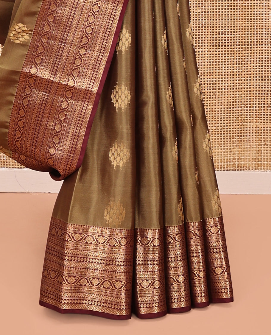 Light Brown Vasundhara Lite Silk Mix Saree, Ornamented With Zari Buttas All Over Its Body, Complemented by Contrast Border of Thilakam Mokku, Kodi Visiry, Neli, Diamond, and Paiyadi Kattam, Grand Pallu and Paired with a Contrast Blouse