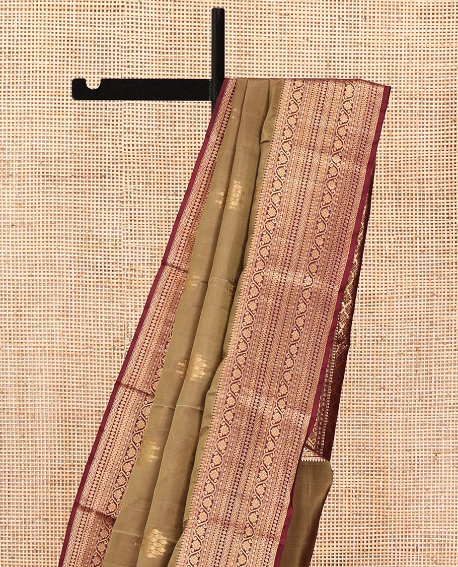 Light Brown Vasundhara Lite Silk Mix Saree, Ornamented With Zari Buttas All Over Its Body, Complemented by Contrast Border of Thilakam Mokku, Kodi Visiry, Neli, Diamond, and Paiyadi Kattam, Grand Pallu and Paired with a Contrast Blouse