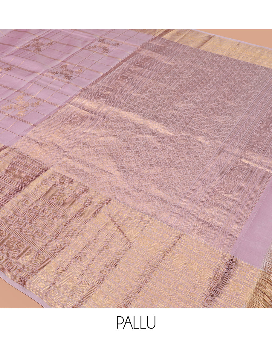 Pink Vasundhara Silk Saree Elevated with Zari Designs All Over Its Body, Complemented by Zari Border of Rekku, Kathir, Star Vanki, Iruthalai Pakshi, and Mayil Designs, a Grand Pallu, and Paired with a Matching Blouse