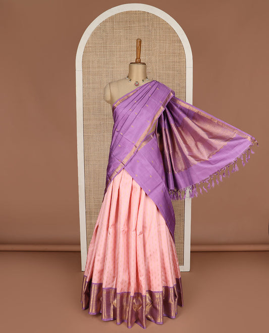 Peach puresilk halfsaree, zari buttas skirt, contrast border, blouse of rekku,banaras,muthu,mayil kann,rettai neli,poun,kathir,rudraksham, and kodi visiry, and zari woven dhavani