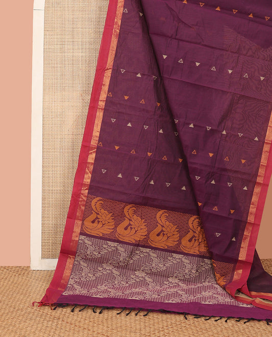Purple Kanchi Cotton Saree, Gleamed Up with Temple Buttas All Over Its Body, Complemented by a Contrast Border, Pallu Depicts Floral Designs, and Paired with a Matching Blouse