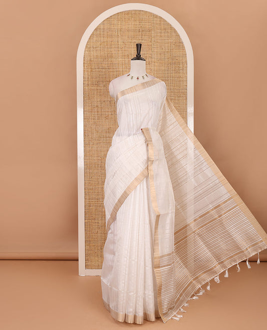 Cream striped tissue saree, gold zari piping border, zari striped pallu & plain blouse
