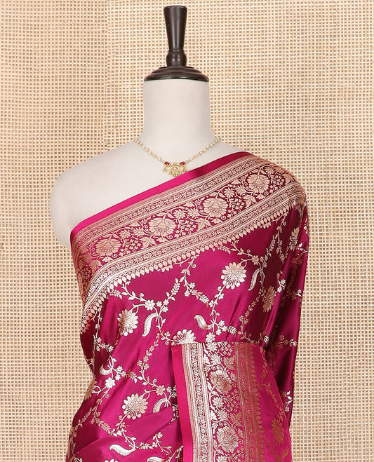 Magenta Semi-Banaras Satin Saree Elevated with Floral Jaal Jacquard Design Weave, Self-Border Featuring Floral Creeper Designs, Majestically Detailed Pallu with Ogee Designs, and Paired with a Matching Blouse