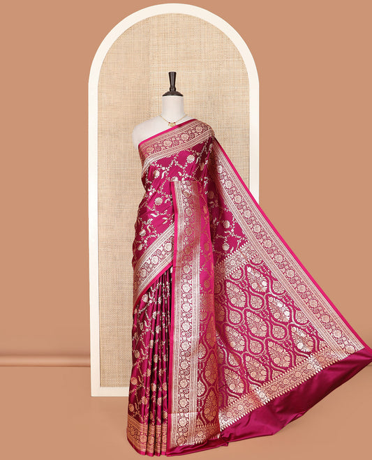 Magenta Semi-Banaras Satin Saree Elevated with Floral Jaal Jacquard Design Weave, Self-Border Featuring Floral Creeper Designs, Majestically Detailed Pallu with Ogee Designs, and Paired with a Matching Blouse