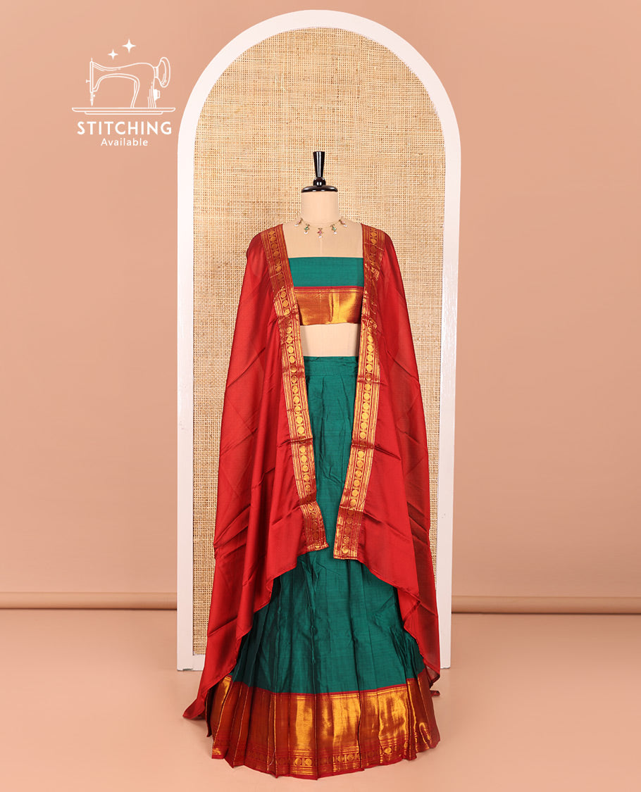Green and Red Mercerised Cotton Half-Saree Featuring Plain Skirt, Adorned with a Contrast Peacock Eye-Rudraksham Motifs Woven Zari Border, Paired with a Matching Blouse, and Contrast Syska Georgette Dhavani with Zari Border