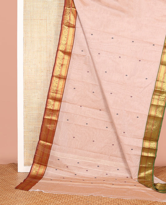 Sandal Chettinad Cotton Saree, Finely Woven with Thread Buttas on Its Body, Complemented by a Contrast Traditional Zari Temple Border of Peacock Chakram Designs, and Subtly Made Pallu of Buttas