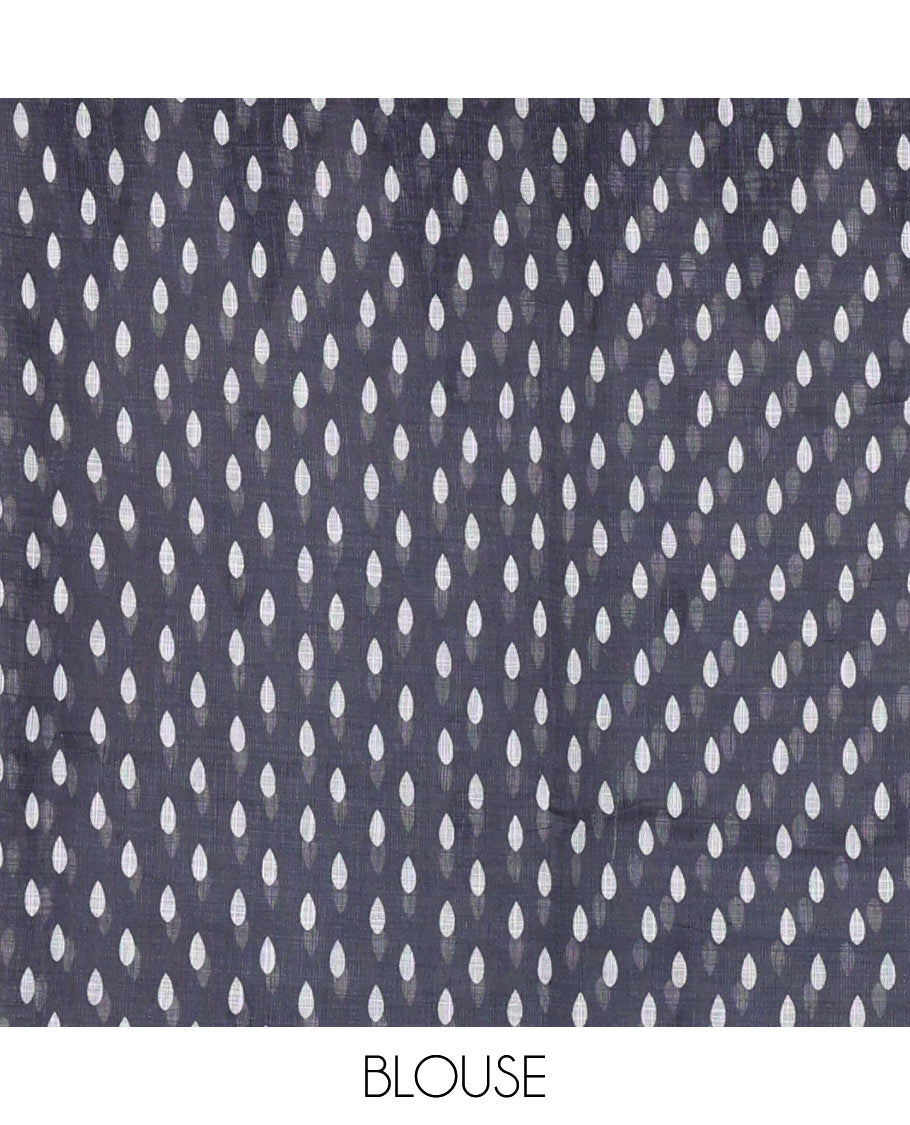 White thilakam buttas and mirror work khadi mul cotton saree, contrast temple border, striped and buttas pallu, and a contrast printed blouse