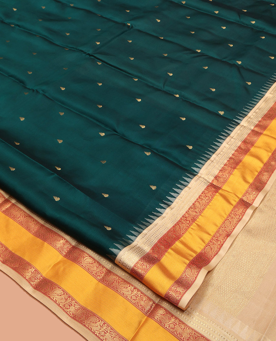 Teal Vasundhara Lite-Silk Mix Saree, Decked Up with Zari Buttas, Contrast Temple Border of Mayil Design, Paiyadi Kattam Pallu, and a Contrast Blouse