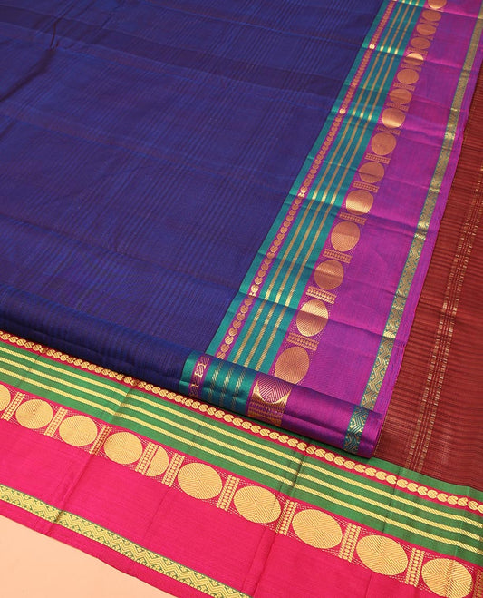 Blue Kanchipuram Silk Saree, Subtly Sparkled with Stripes All Over Its Body, Complemented by a Contrast Border of Manga, Banaras, Poun, and Rettai Neli Designs, Pallu of Zari Stripes, and Paired with a Contrast Blouse