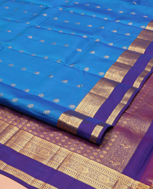 Blue Vasundhara Lite Silk Mix Saree, Detailed with Zari Buttas on Its Body, Complemented by a Contrast Border of Thilakam, Rudraksham, Manga, and Mayil Designs, Grand Pallu, and Paired with a Contrast Blouse