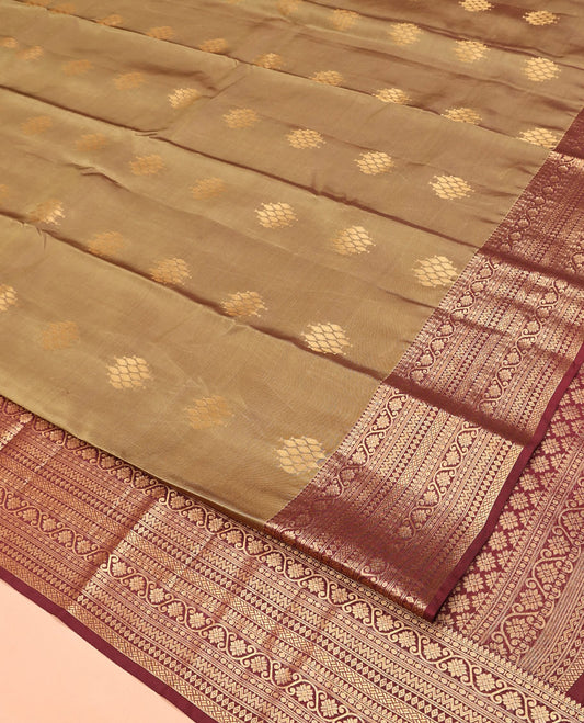 Light Brown Vasundhara Lite Silk Mix Saree, Ornamented With Zari Buttas All Over Its Body, Complemented by Contrast Border of Thilakam Mokku, Kodi Visiry, Neli, Diamond, and Paiyadi Kattam, Grand Pallu and Paired with a Contrast Blouse