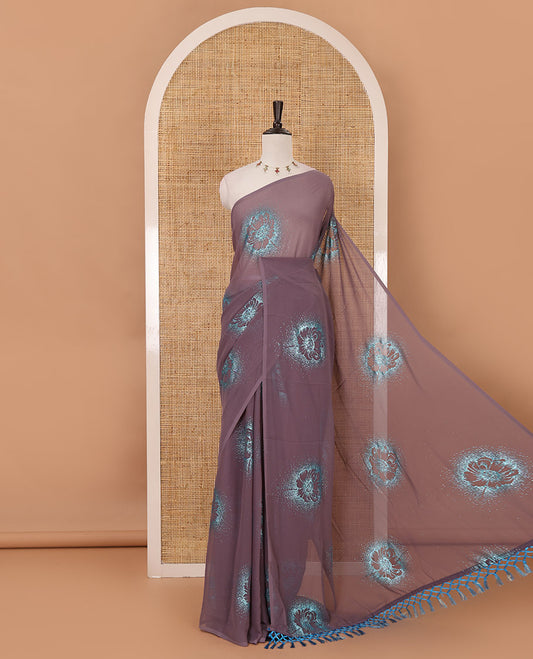 Borderless pastel lilac 60 gm georgette saree features floral vine designs, glitter embroidery work, contrast plain blouse