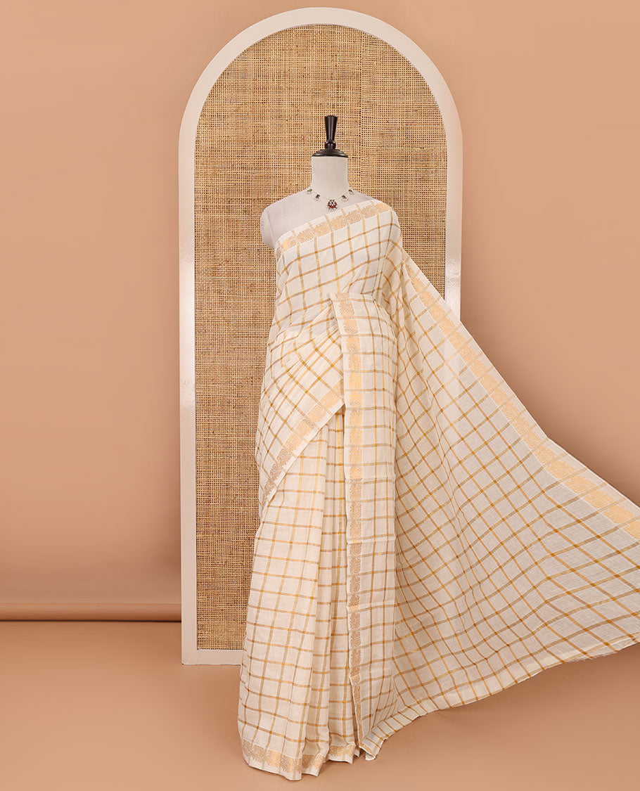 Cream golden zari checked sungudi cotton saree, zari border of peacock motifs & contrast red checked peacock motif blouse