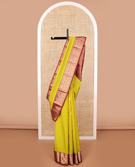 Light green buttas vasundhara elite silk saree with contrast traditional zari design border & checked floral design pallu