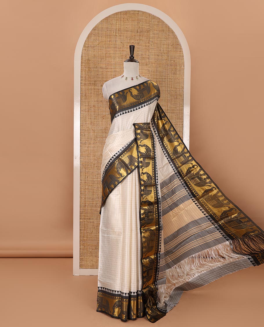White checked semi-tafeta saree, contrast temple zari elephant motifs black color border, zari-rich pallu & contrast checked zari border blouse